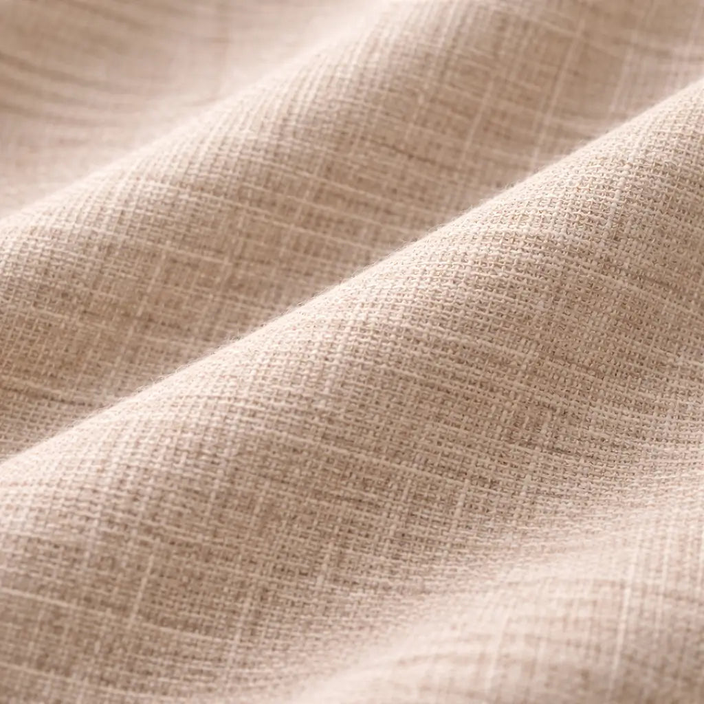 Close-up of beige fabric with a textured pattern