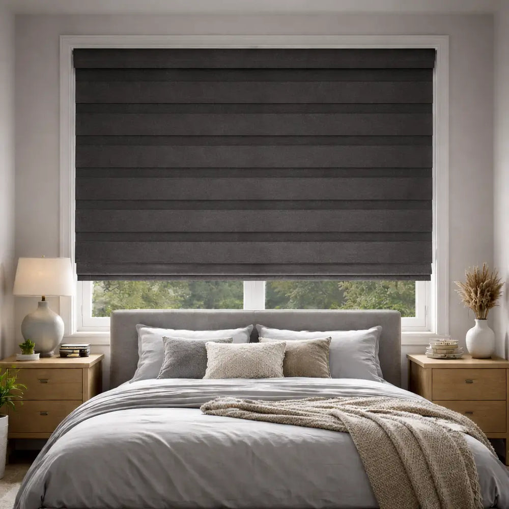 Charcoal Blackout Zebra Shades in the closed position, demonstrating full privacy and light blocking in a bedroom.