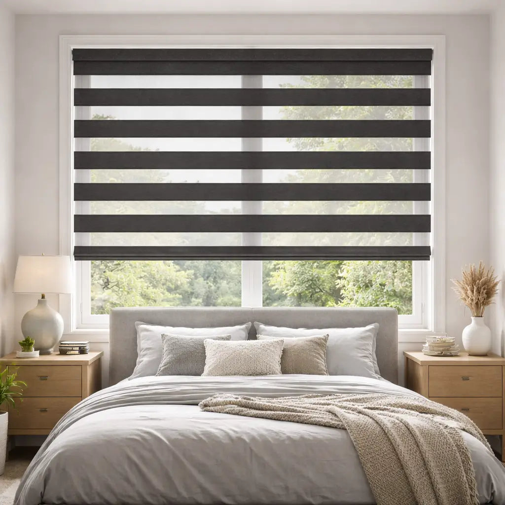 Bedroom with Charcoal Blackout Zebra Shades in the open position, allowing striped natural light.